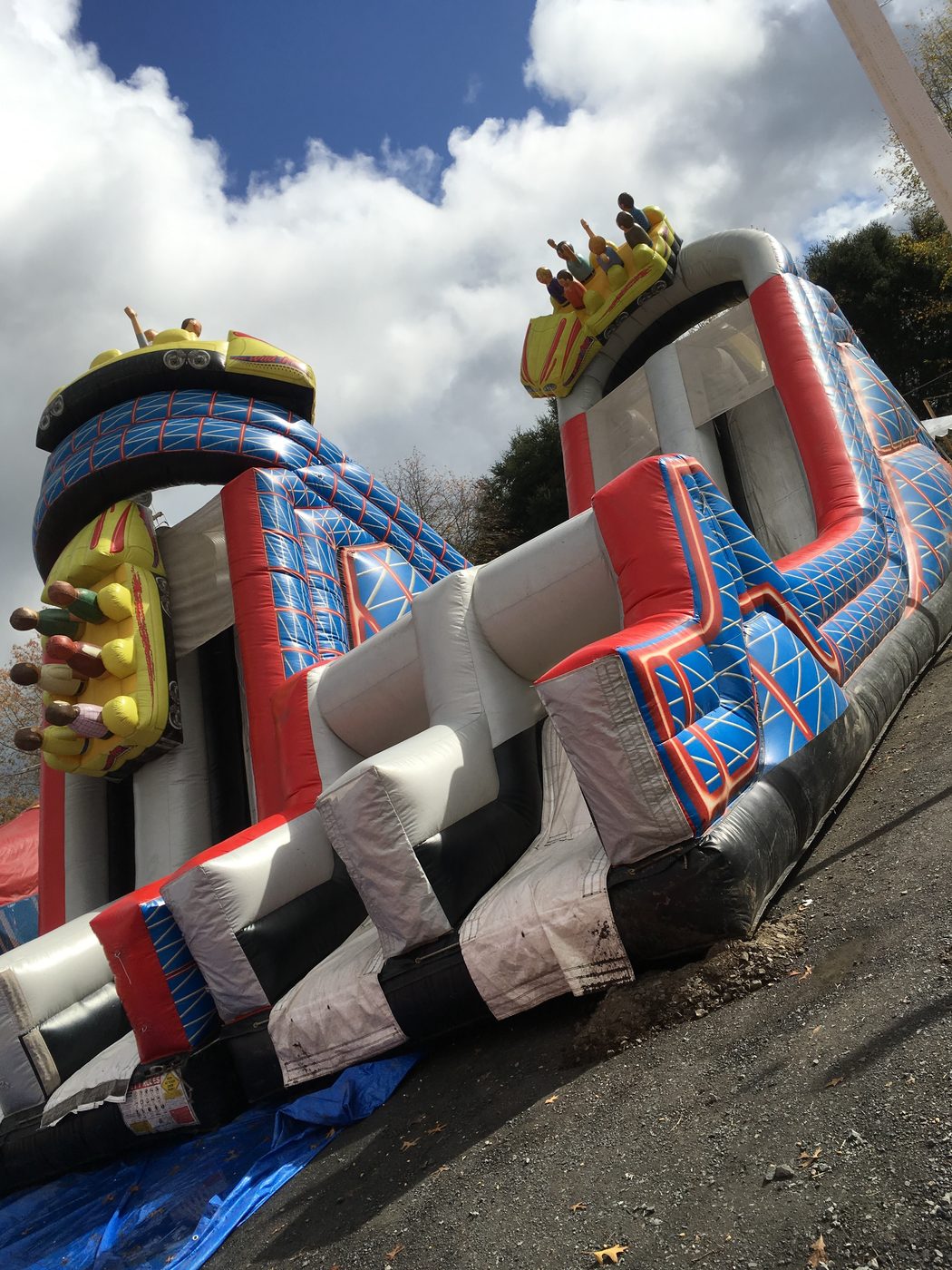 Roller-coaster themed inflatable with yellow cars
