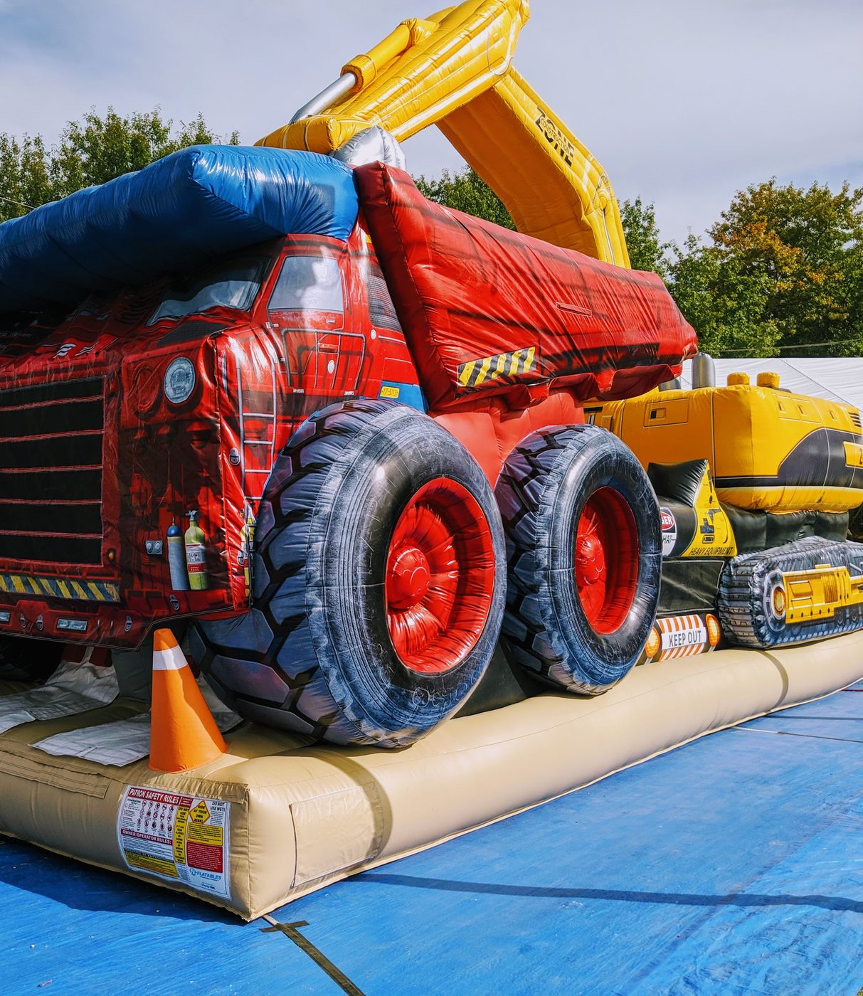 Yellow excavator section of the construction jump house