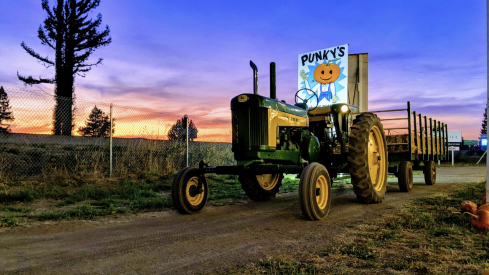 Punky's tractor and hay wagon at sunset